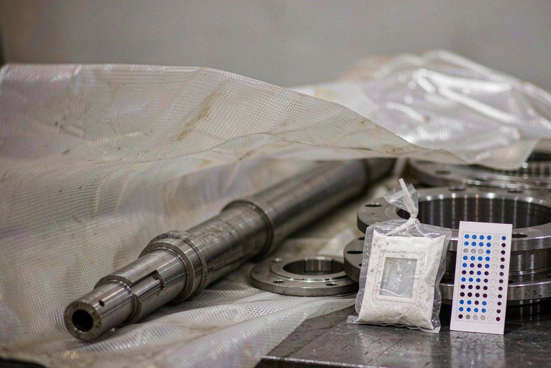 Steel shafts and flanges wrapped in VCI film with a desiccant sachet and humidity card