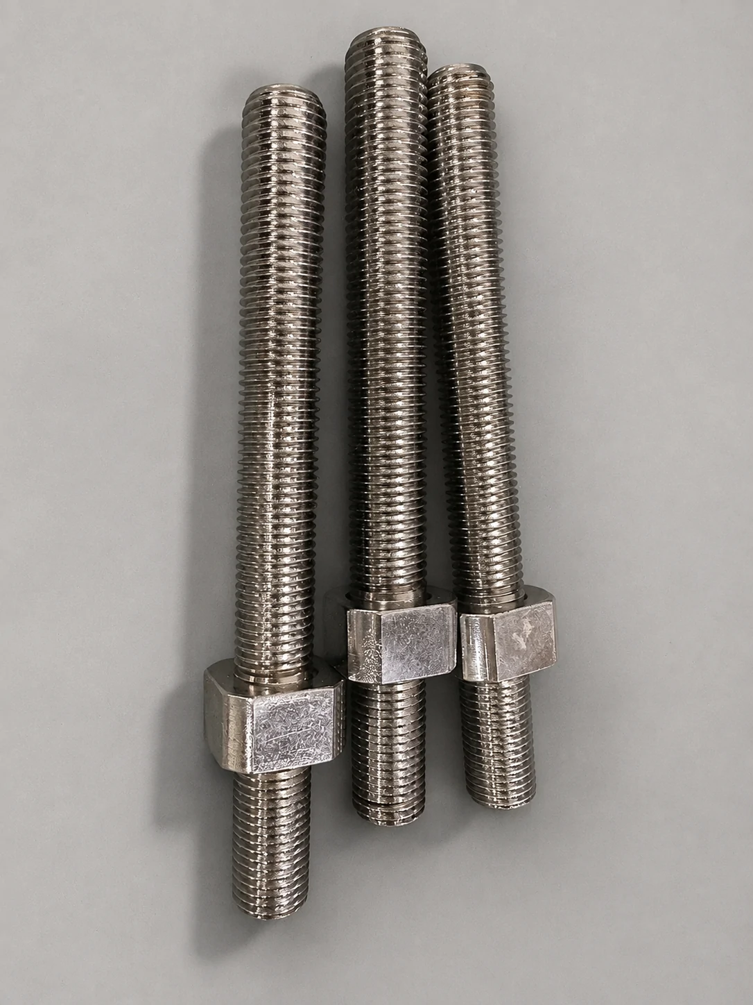 Turned metal studs with externally threaded sections