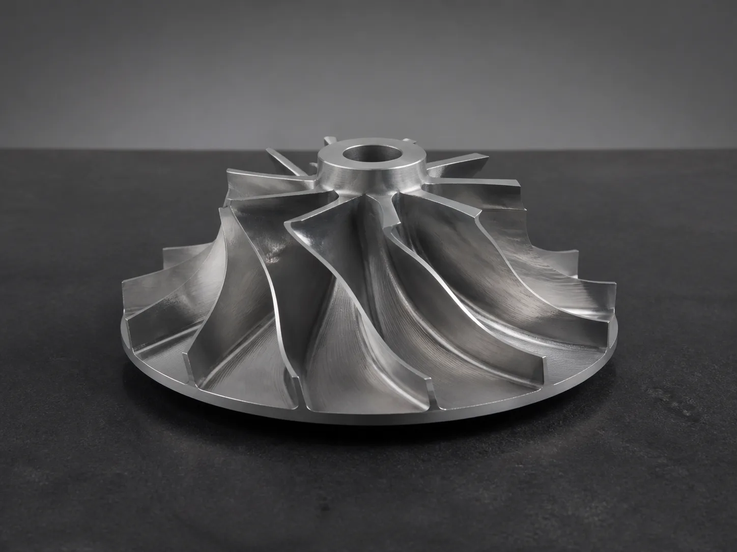 Machined metal impeller with twisted freeform blades