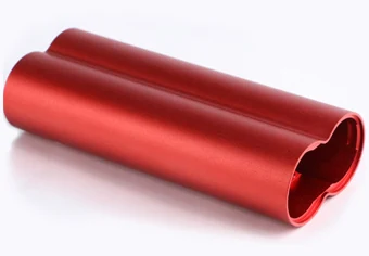 Red anodized cylindrical component illustrating a colored aluminum finish