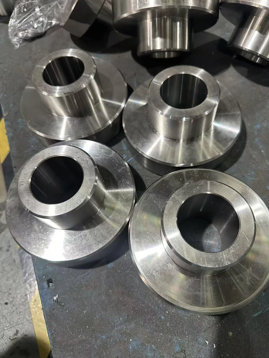 Original HongKe workshop photograph of flanged bushings with central bores