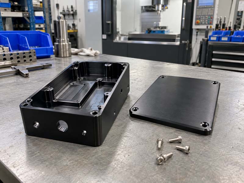 Black anodized aluminum enclosure with cover and screws