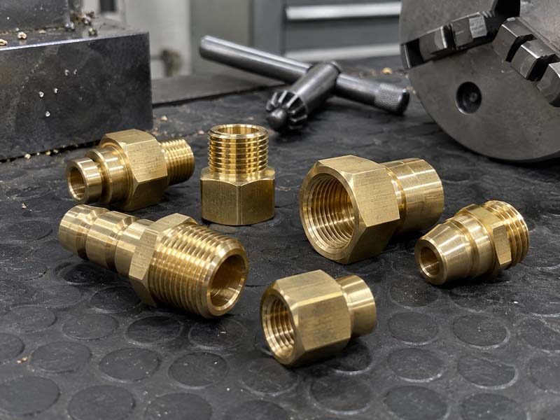 Set of brass threaded fittings machined on CNC lathes